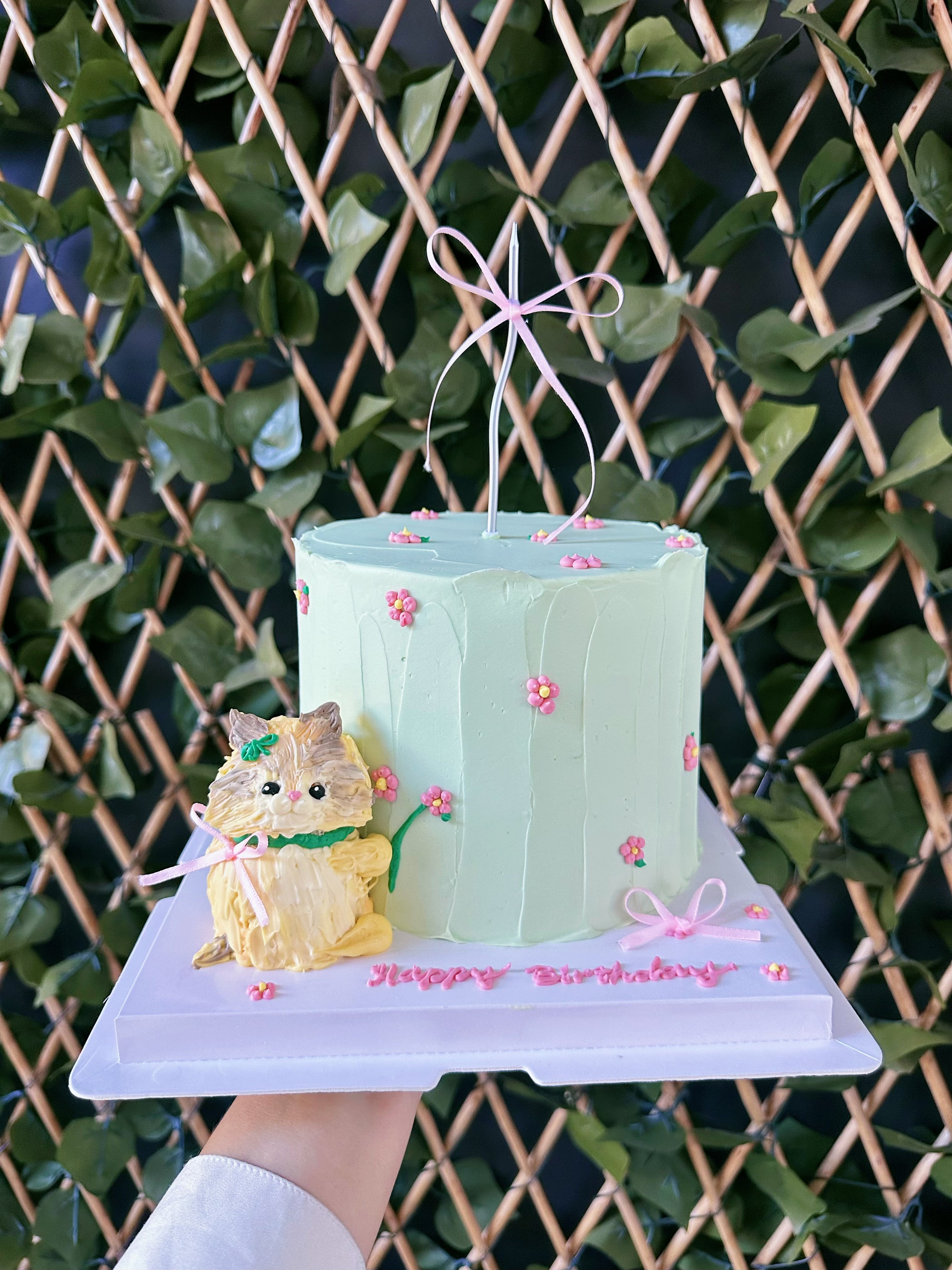 Handmade buttercream kitten cake